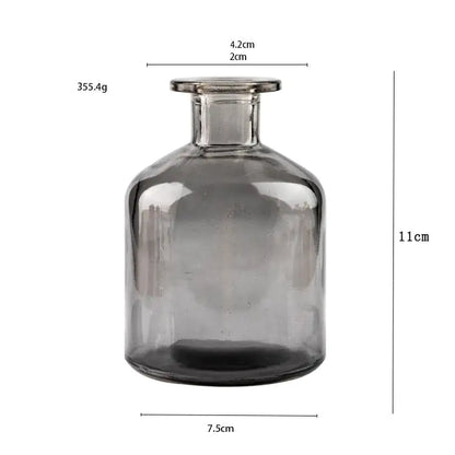 Close-up of Nordic glass flower vase decor with transparent glass