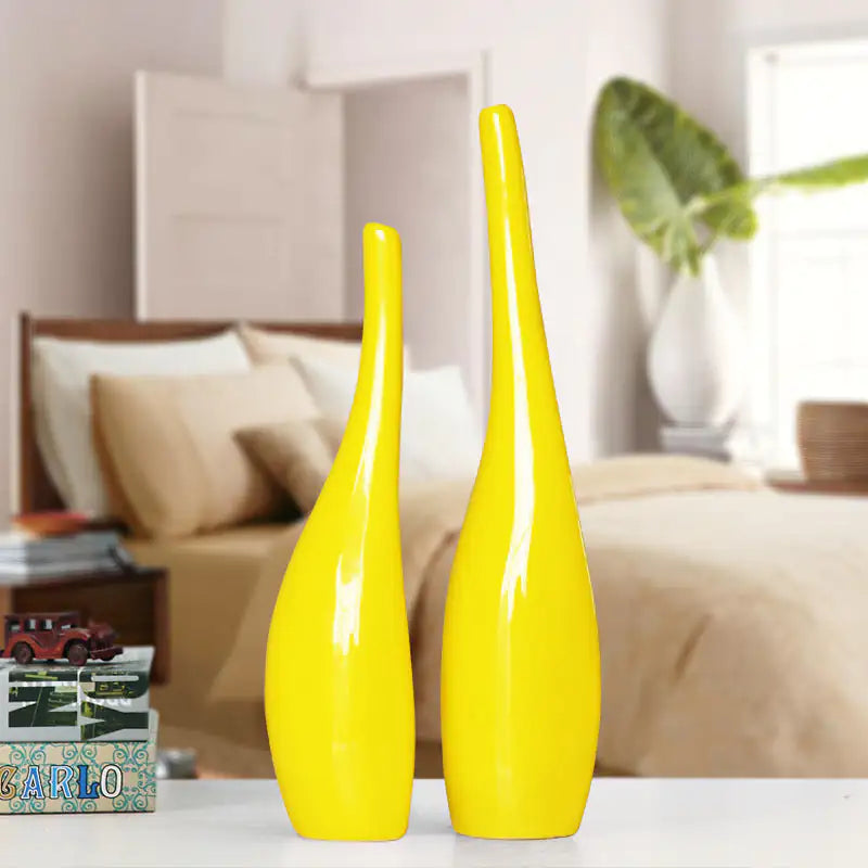Nordic gold ceramic vases in a minimalist living room with yellow decor accent.