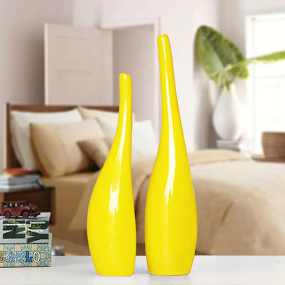 Nordic gold ceramic vases in a minimalist living room with yellow decor accent.