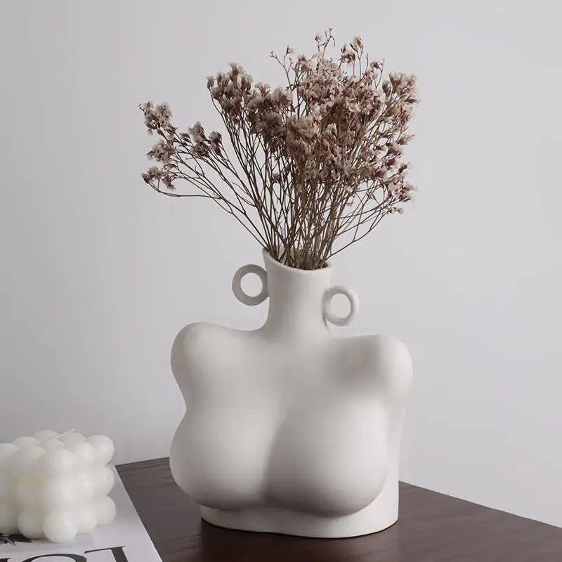 Ceramic sculpture vase with flowers