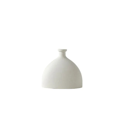 Nordic ceramic vase decor in minimalistic design with smooth matte finish for modern home accents.