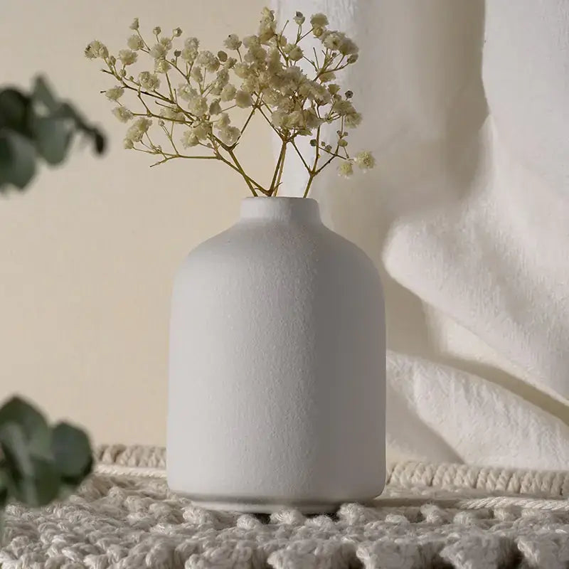Handcrafted simple ceramic vase decor close-up