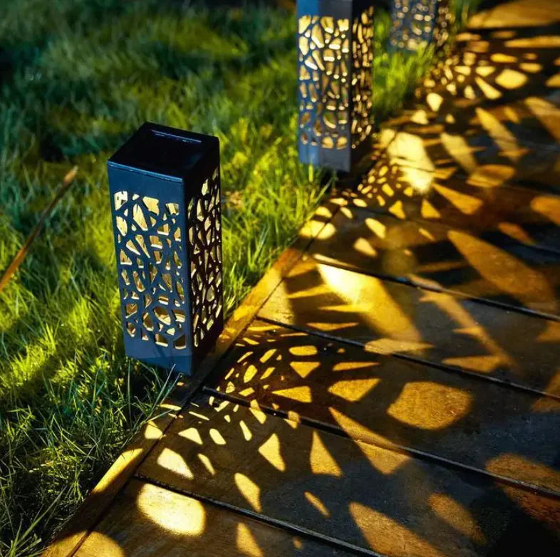 Solar powered vintage garden light on pathway