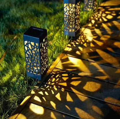 Solar powered vintage garden light on pathway